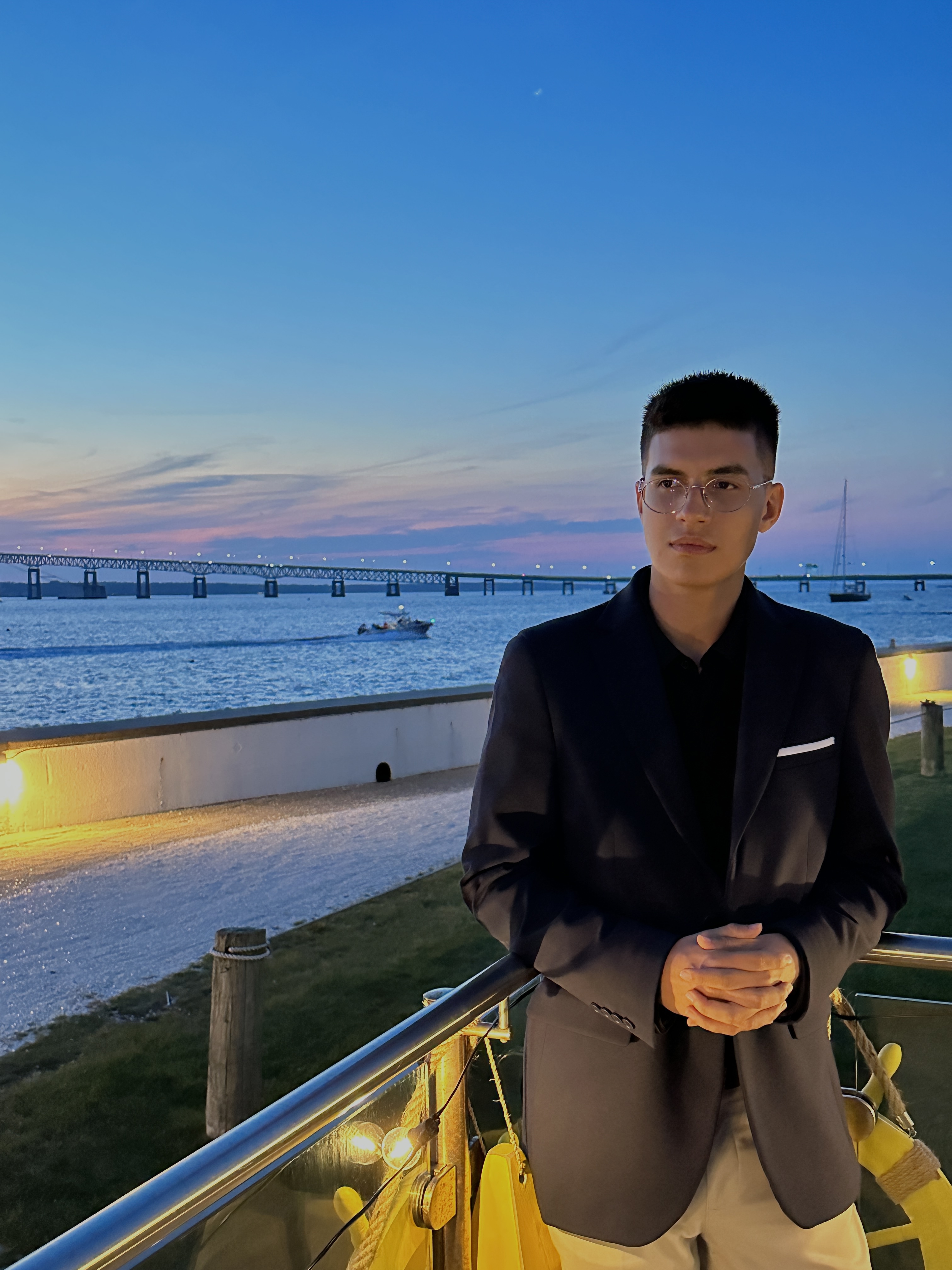 Santiago Duran in a suit by the water
